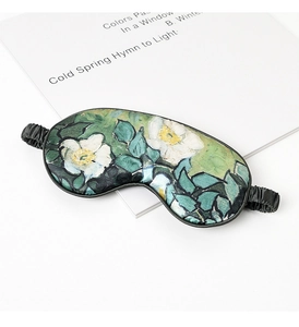 Macro detail of silk sleep mask featuring Van Gogh white roses oil painting print