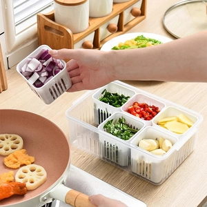 Multi-grid transparent kitchen storage box with drain for onion, ginger and garlic prep.