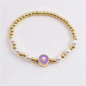 Fashionable Hamsa Hand charm bracelet with gold beads, white pearls and purple enamel pendant