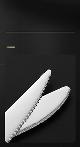 Macro detail of sharp serrated edges on integrated 304 stainless steel dinner knife