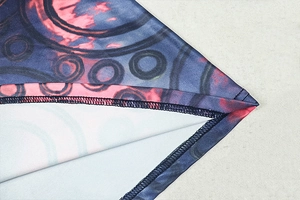 Macro detail of abstract blue and pink print on elastic bodycon dress with quality stitching