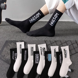 Street style breathable cotton crew socks with athletic lettering in black and white