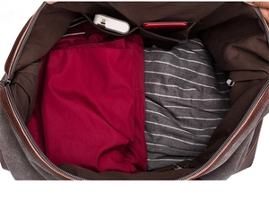 Spacious interior of canvas travel bag featuring large capacity storage and inner pockets