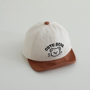 Close-up of baby baseball cap featuring Cute Bear embroidery and contrast visor