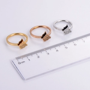 Detailed comparison of double butterfly rings in gold, rose gold, and silver finishes
