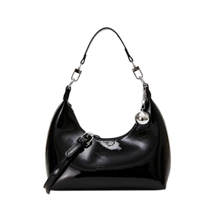 Glossy black patent leather dumpling handbag with silver metal ball pendant accessory