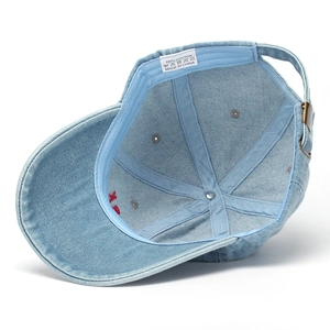Close-up of internal cotton sweatband and adjustable strap on denim baseball cap