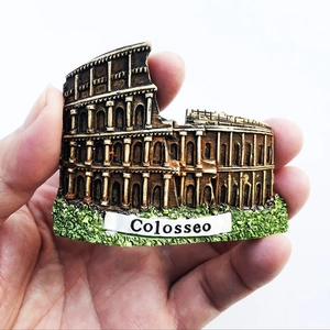 Close-up of hand-held resin Colosseo souvenir magnet with detailed 3D Roman Colosseum design