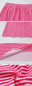 Detail view of pink and white striped swimwear fabric with fine pleats and stitching