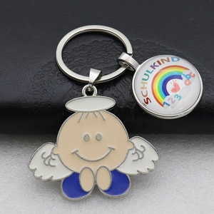 Detail of metal rainbow keychain with enamel angel charm and Schulkind glass pendant