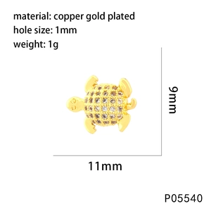Detail of 11mm turtle charm in gold-plated copper with white zircon and size specs