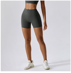 Macro shot of high-waisted seamless grey yoga shorts showing supportive stretch fabric texture