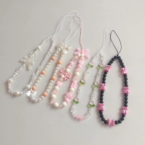 Chic handmade beaded phone charms with colorful acrylic hearts and stylish bow knots