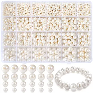 Detail of 24-compartment storage box with assorted cream white faux pearls for DIY jewelry