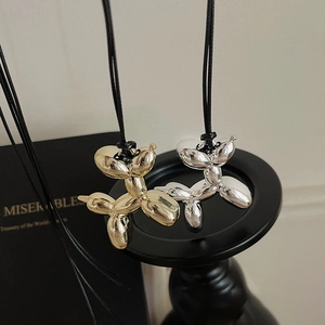 Y2K style metallic balloon dog necklaces in gold and silver finish with sleek plating