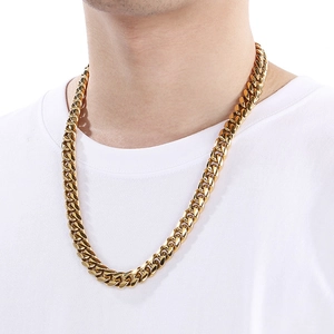 Close-up of a 12mm golden Miami Cuban link chain necklace on a model for a hip-hop style look