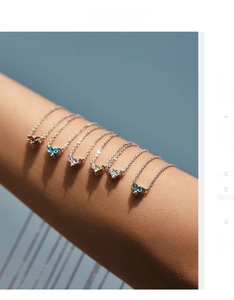 S925 sterling silver heart-shaped gemstone necklaces displayed on female forearm
