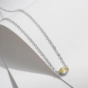 Minimalist S925 sterling silver necklace featuring an oval yellow cubic zirconia pendant