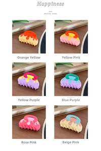 Detailed grid view showing six vibrant dual-color fluid resin hair claws on wooden background