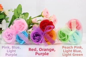 Three heart-shaped gift boxes with colorful soap flower roses and ribbon bows