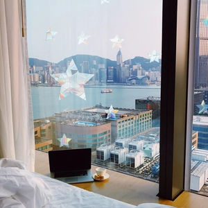 Rainbow prism star window stickers creating colorful light effects in a cozy room view