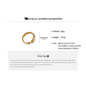 Detail view of gold alloy cuff bracelet with dimensions 6.2cm by 6.7cm and 3.3cm width