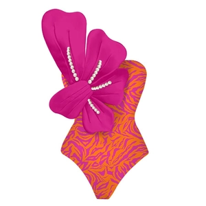 Detail of tiger print swimsuit with 3D magenta flower and white pearl embellishments