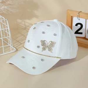 Elegant white floral baseball cap with sparkling rhinestone butterfly and crystal detail