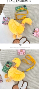 Detail view of the soft plush duck crossbody bag with adjustable yellow nylon strap