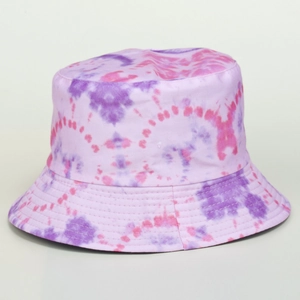 Detail view of purple and pink tie-dye bucket hat showing cotton fabric and stitching