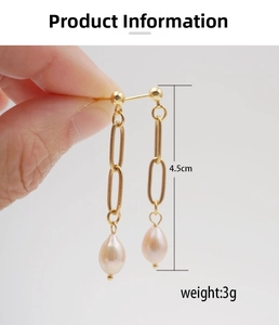 Detail view of gold chain drop earrings with pearls showing 4.5cm length and 3g weight