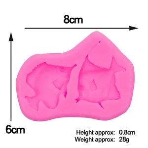 Molde de silicona rosa con peces tropicales para decorar pasteles y repostería creativa