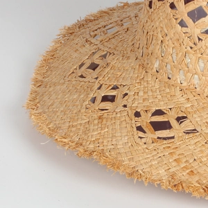 Handmade straw sun hat with openwork crochet texture and fringe brim detail