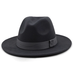 Detail of black wool fedora hat featuring tonal woven band and side ribbon knot
