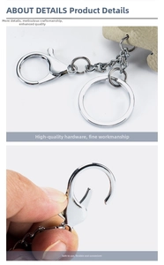 Close-up of bright silver hardware including lobster clasp and key ring on leather keychain
