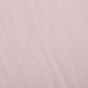 Detailed macro view of light pink pleated fabric with vertical texture and soft lighting
