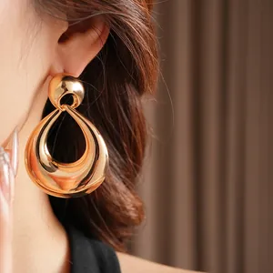 Polished gold teardrop hollow earrings in retro geometric style for women's fashion