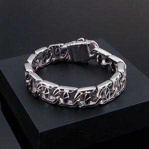 Detailed close-up of hip-hop silver cuban chain bracelet with geometric hollow links