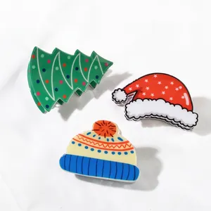 Three-piece Christmas hair claw clips featuring Santa hat, tree, and knit cap shapes