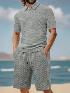 Detail of grey men's polo set with distinctive V-shape knit texture for summer beachwear
