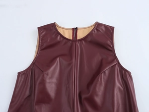 Detail of burgundy PU leather sleeveless top showing interior lining and stitch texture