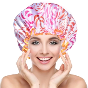 Detail of pink and orange patterned waterproof satin shower cap on smiling model