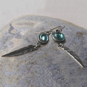 Vintage bohemian feather drop earrings with turquoise blue stones in silver finish
