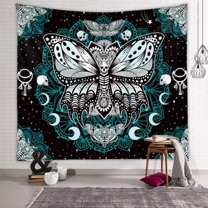 Gothic moth butterfly tapestry with mandala and skull on white brick wall background