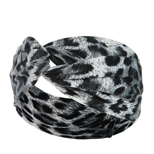 Detailed view of twist knot headband with black and white leopard pattern fabric