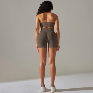 Detail view of mocha seamless yoga set back showing ribbed waistband and elastic texture
