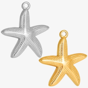 Detailed close-up of gold and silver starfish pendants with textured stainless steel surface
