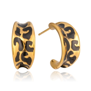 Detailed view of C-shaped gold-tone earrings with black leopard print enamel finish