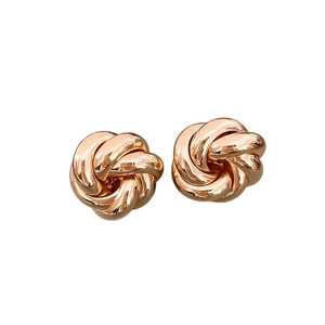 Elegant rose gold love knot stud earrings in high-polished metal with a minimalist design