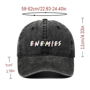 Close-up of ENEMIES letter embroidery on vintage washed black denim baseball cap